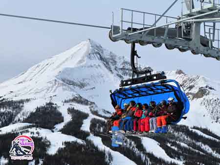 Skiers on Big Ski resort lifts 